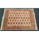 Vintage patterned carpet on beige ground 188x135cm.