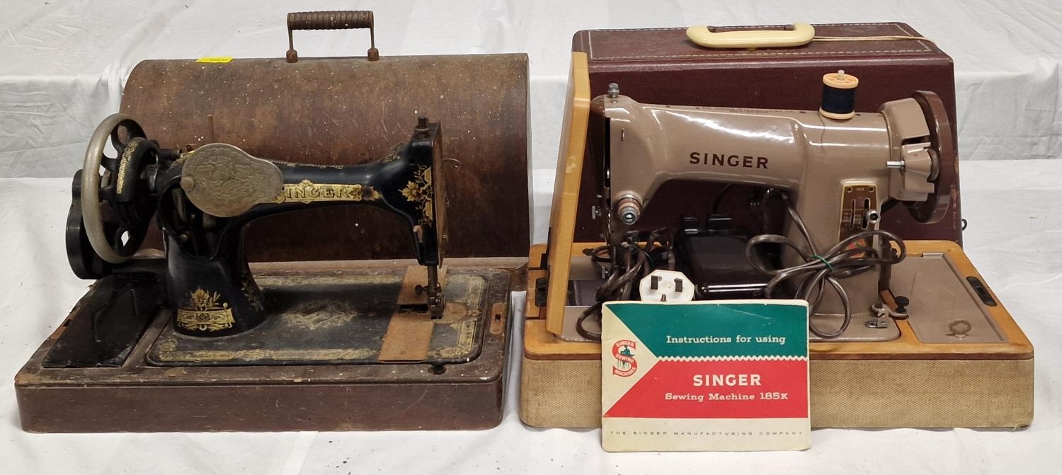 Two vintage Singer sewing machines. One has instruction booklet.