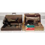 Two vintage Singer sewing machines. One has instruction booklet.