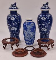Pair of Chinese cobalt blue lidded ginger jars each 32cm tall together with another vase and some