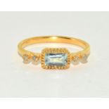 A natural aquamarine and diamond gold on silver ring Size N 1/2.