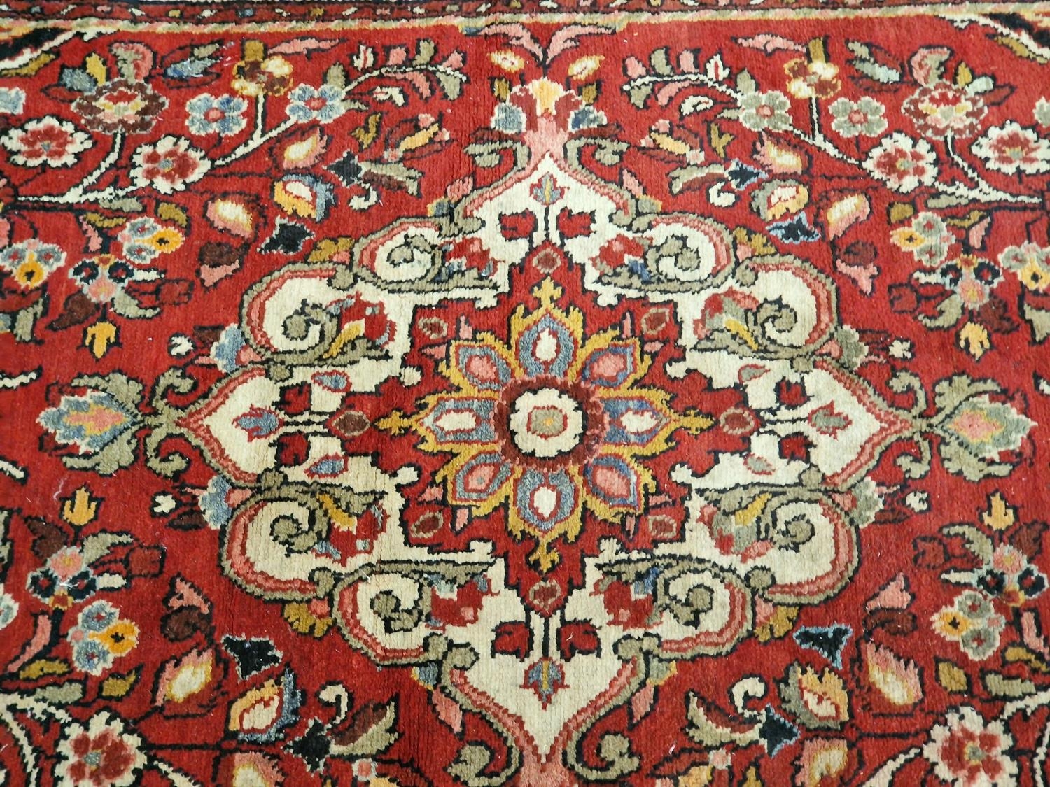 Large vintage patterned carpet on red ground 271x153cm. - Image 2 of 5