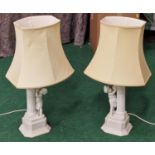 Pair of contemporary table lamps depicting children and Corinthian columns includes shades.