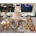 A large collection of miscellaneous light fittings, lamp bases and light shades.