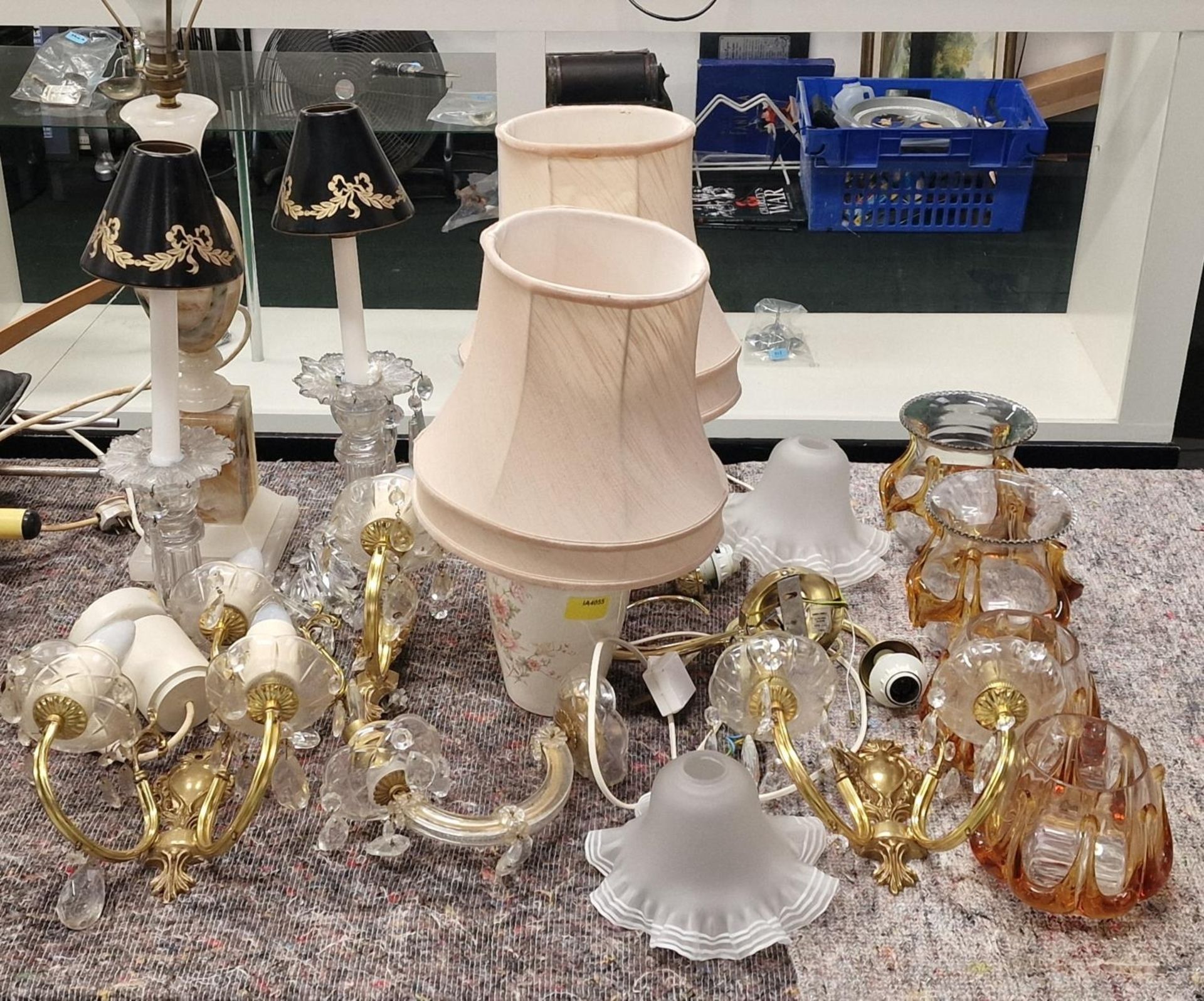 A large collection of miscellaneous light fittings, lamp bases and light shades.