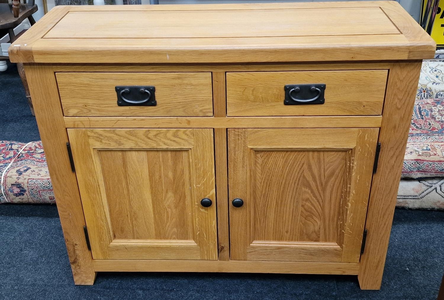 Contemporary light oak 2 door 2 draw cabinet with drop handles 78x98x35cm