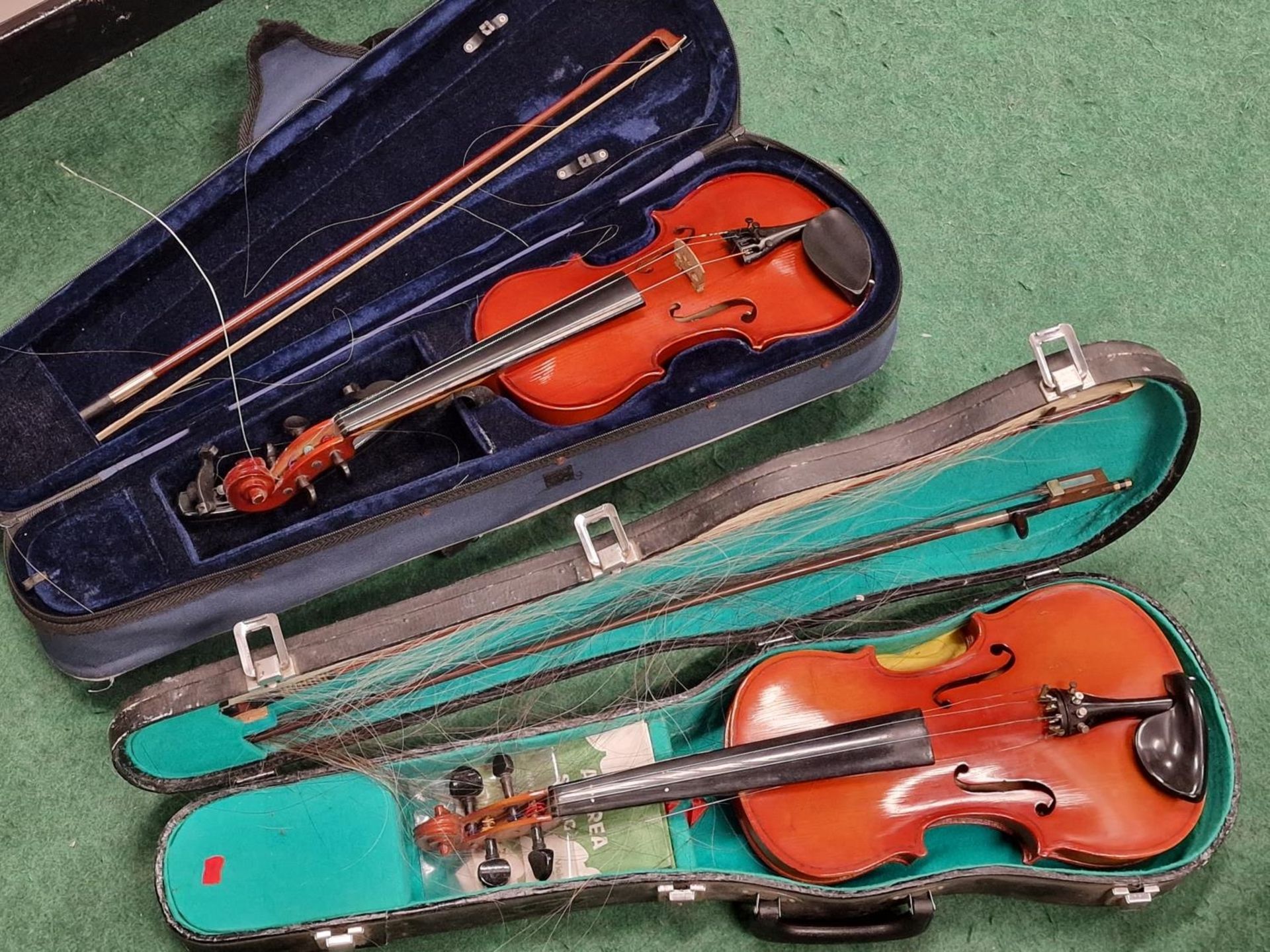 2 x violins both with hard carry cases and bows