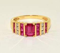 Ruby approx 0.75 point centre and diamond 18ct gold ring Size T, 5g.