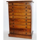 Large wooden engineers cabinet comprising 10 drawers, mostly empty but for a small amount of watch