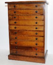 Large wooden engineers cabinet comprising 10 drawers, mostly empty but for a small amount of watch
