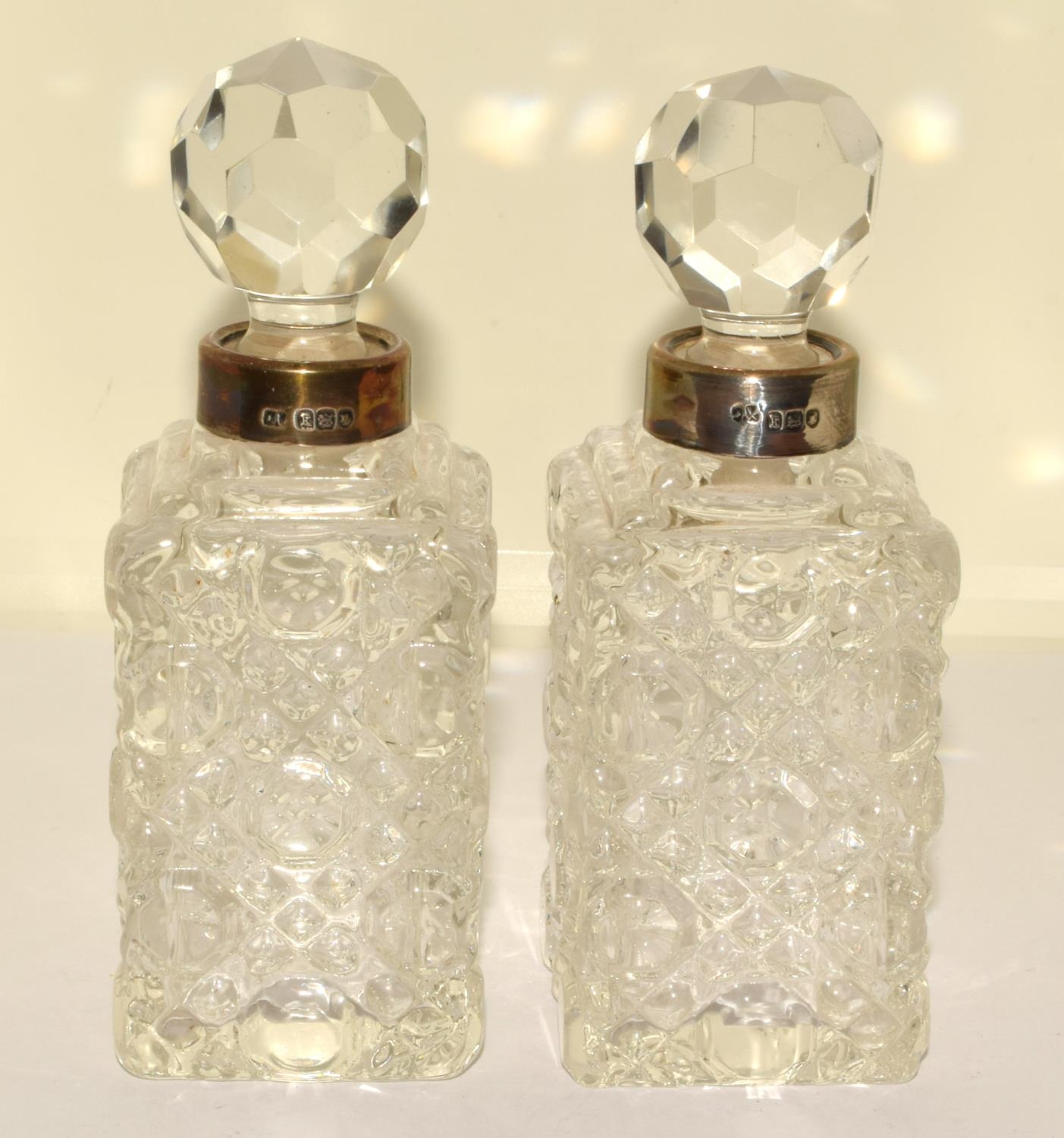 Pair Chrystal glass silver collard perfume bottles and stoppers 12x4x4cm