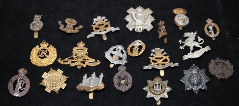 A collection of mostly WWI - WWII Era regimental cap badges, good collectable examples. 20 in lot