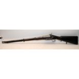 Antique muzzle loading percussion musket with foundry/armoury marks. O/all length 212cms. Wall