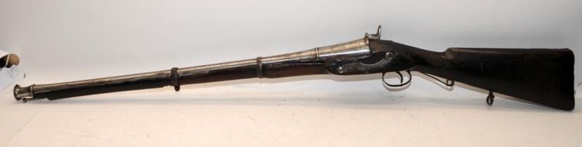 Antique muzzle loading percussion musket with foundry/armoury marks. O/all length 212cms. Wall