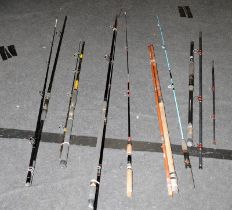 A quantity of vintage boat and beach fishing rods. Various makes and sizes