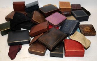 A collection of pocket watch cases and pouches including antique examples