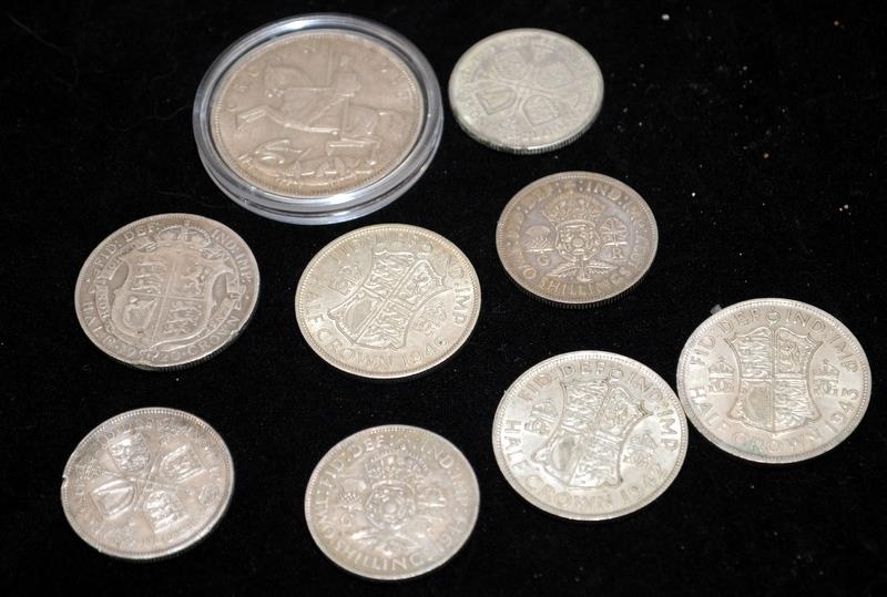 A small collection of pre 1947 half silver coins to include a 1935 Rocking Horse Crown