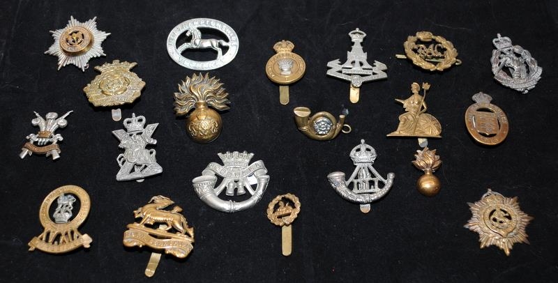 A collection of mostly WWI - WWII Era regimental cap badges, good collectable examples. 20 in lot