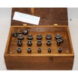 Watch makers lathe special 6mm collet set housed in a hinged wooden box. From a working environment,