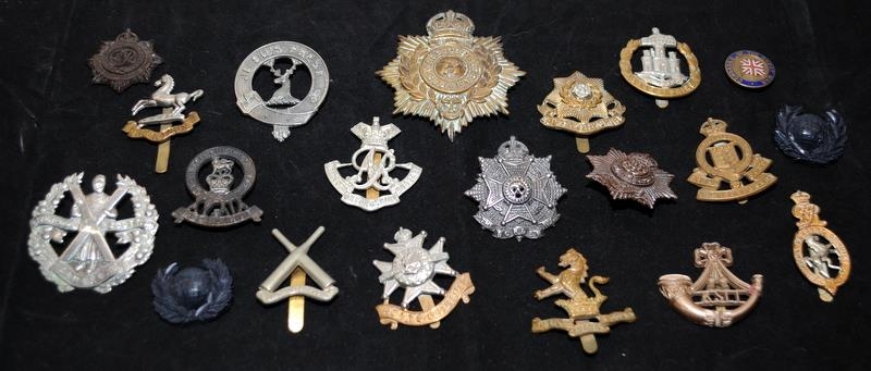 A collection of mostly WWI - WWII Era regimental cap badges, good collectable examples. 20 in lot