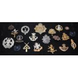 A collection of mostly WWI - WWII Era regimental cap badges, good collectable examples. 20 in lot