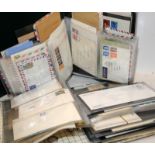 Two large folders of early first day covers and stamped envelopes, GB and World examples