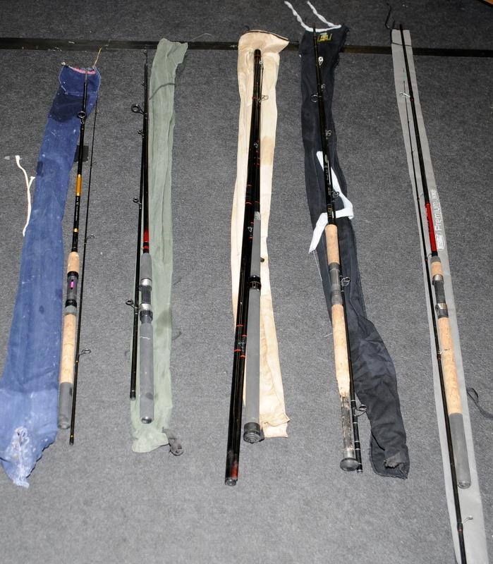 A collection of course fishing rods, including Mitchell and Shakespeare.