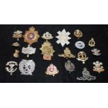 A collection of mostly WWI - WWII Era regimental cap badges, good collectable examples. 20 in lot