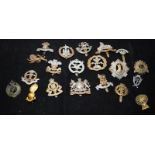 A collection of mostly WWI - WWII Era regimental cap badges, good collectable examples. 20 in lot