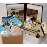 Two boxes and an album of vintage postcards, various ages and images