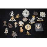 A collection of mostly WWI - WWII Era regimental cap badges, good collectable examples. 20 in lot