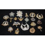 A collection of mostly WWI - WWII Era regimental cap badges, good collectable examples. 20 in lot