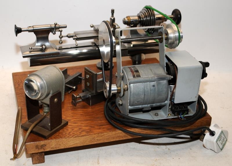 Quality vintage watchmakers/jewellers lathe mounted on board c/w motor and accessories. From a