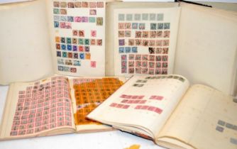 A number of vintage stamp albums containing stamps from the Victorian period through to mid 20th