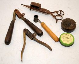 Collection of vintage bullet/pellet moulds, a lead measure and other items