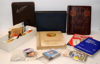 A collection of vintage cigarette card collectors albums (empty) c/w Collectors reference books