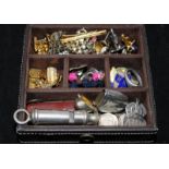A small jewellery box containing costume jewellery including cufflinks. Also includes vintage ARP