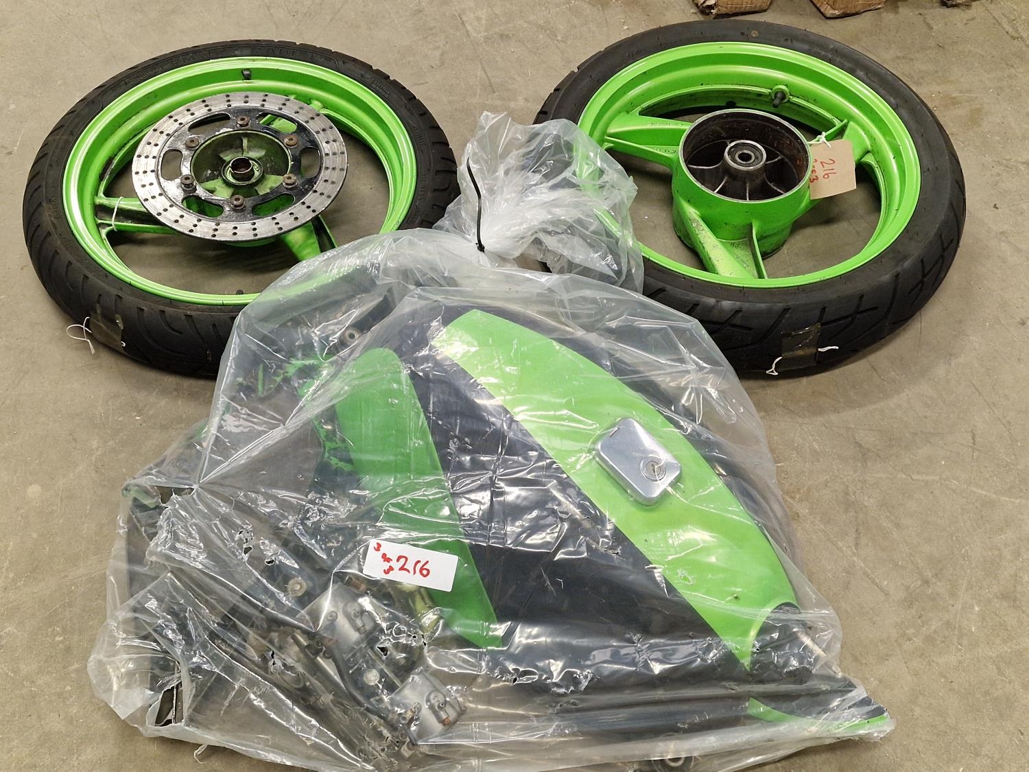 Two motorcycle wheels together with some spare parts (REF 216).