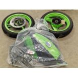 Two motorcycle wheels together with some spare parts (REF 216).