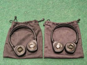 Two pairs of genuine Land Rover headphones with fabric cases.