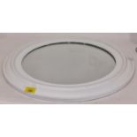 A round white framed mirror (230)