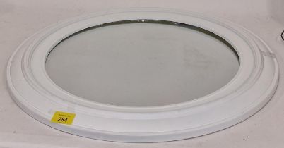 A round white framed mirror (230)