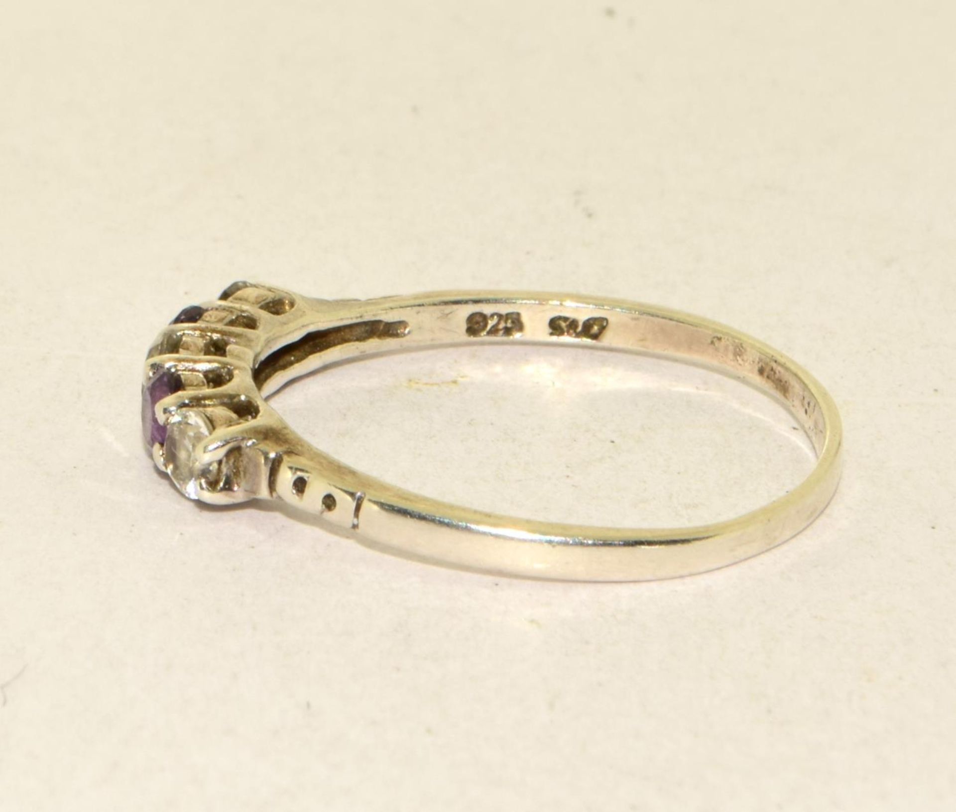 A 925 silver, CZ and amethyst ring Size W - Image 2 of 3