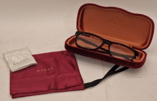 Pair of designer glasses marked "Gucci" complete with case, bag and cleaning cloth.