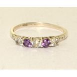 A 925 silver, CZ and amethyst ring Size W