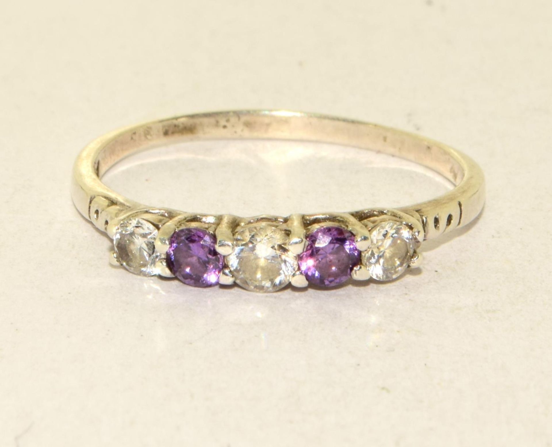 A 925 silver, CZ and amethyst ring Size W