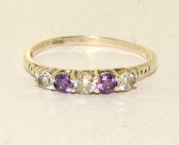 A 925 silver, CZ and amethyst ring Size W