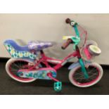 A pink child's Trolls bike with basket and stablers. (19B)