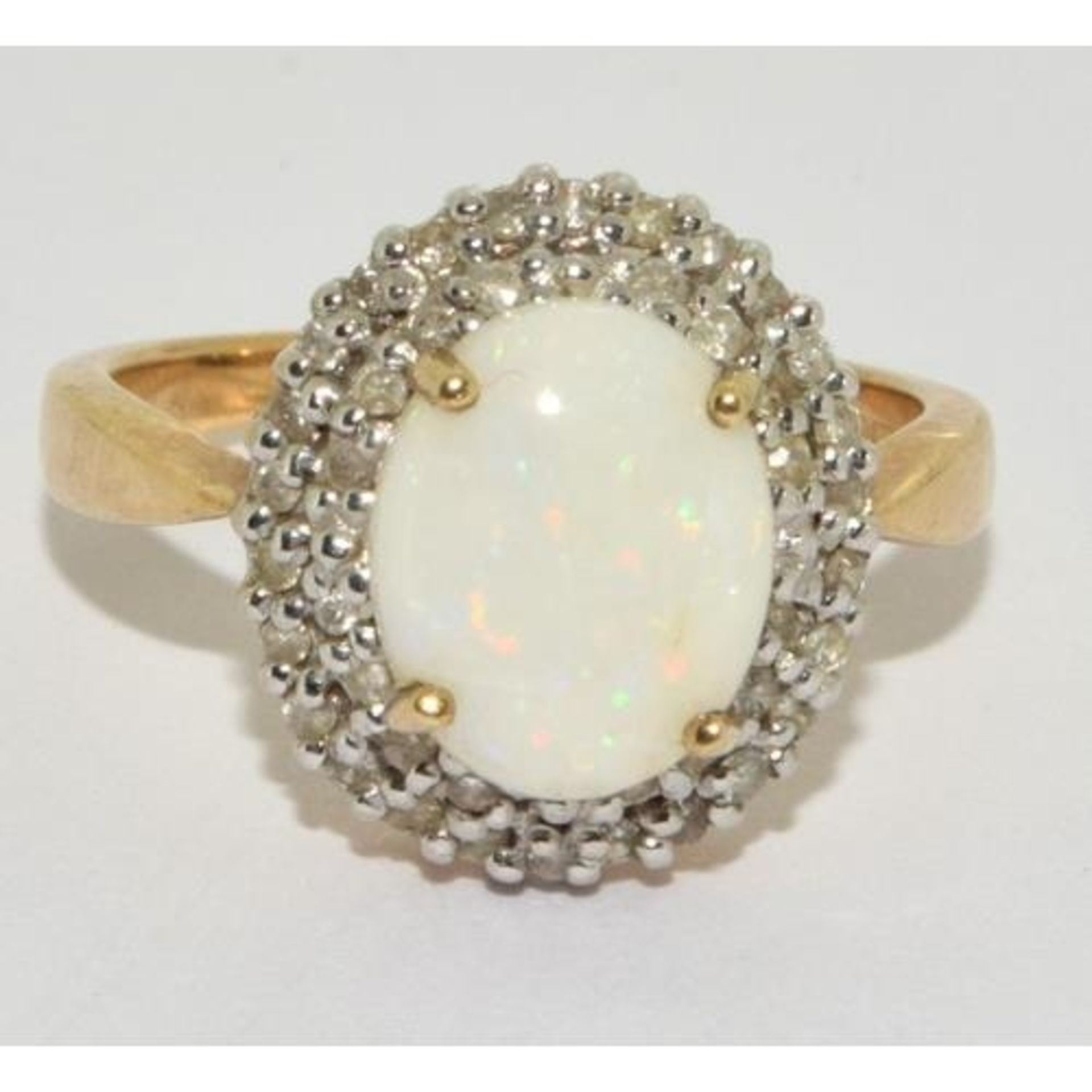 9ct gold ladies Diamond and Opal statement ring in a halo design setting approx size N - Image 5 of 5