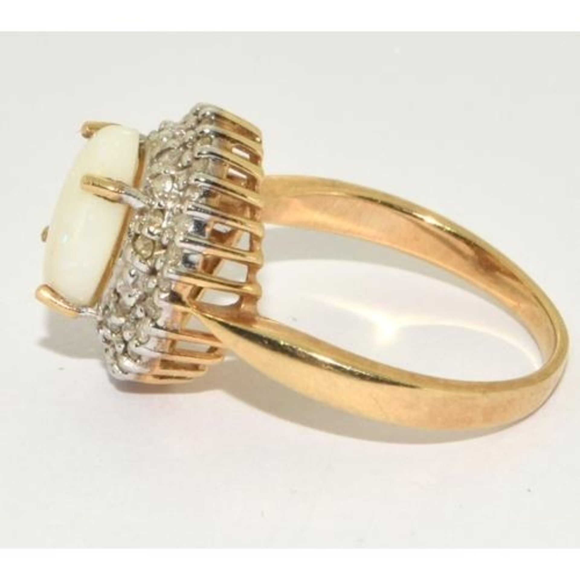 9ct gold ladies Diamond and Opal statement ring in a halo design setting approx size N - Image 2 of 5